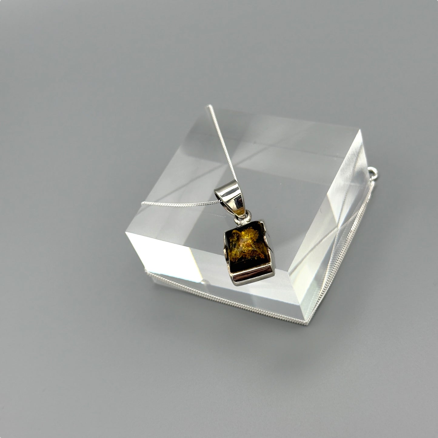 Side view of rectangular amber necklace