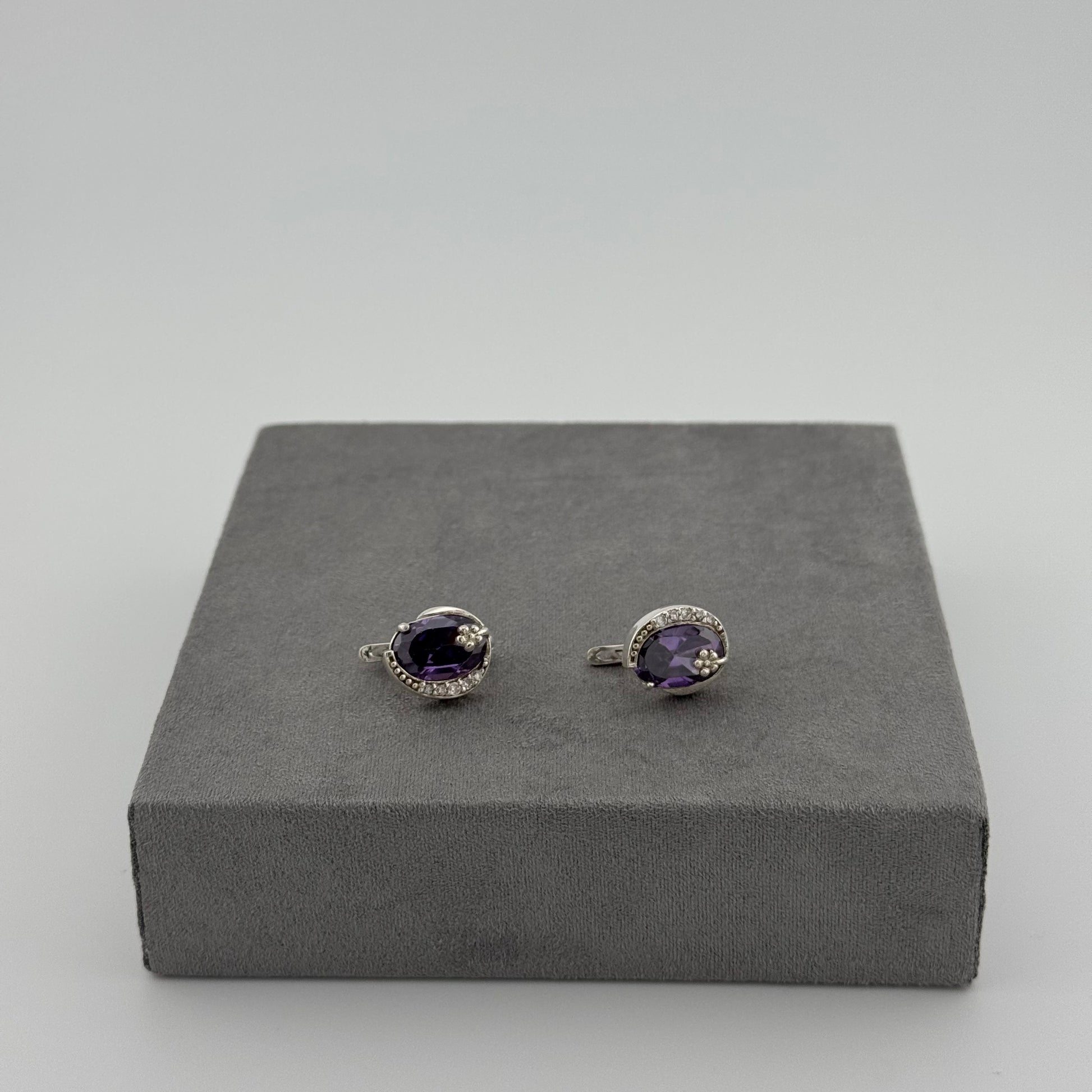 sterling silver amethyst earrings with an oval amethyst stone and floral design