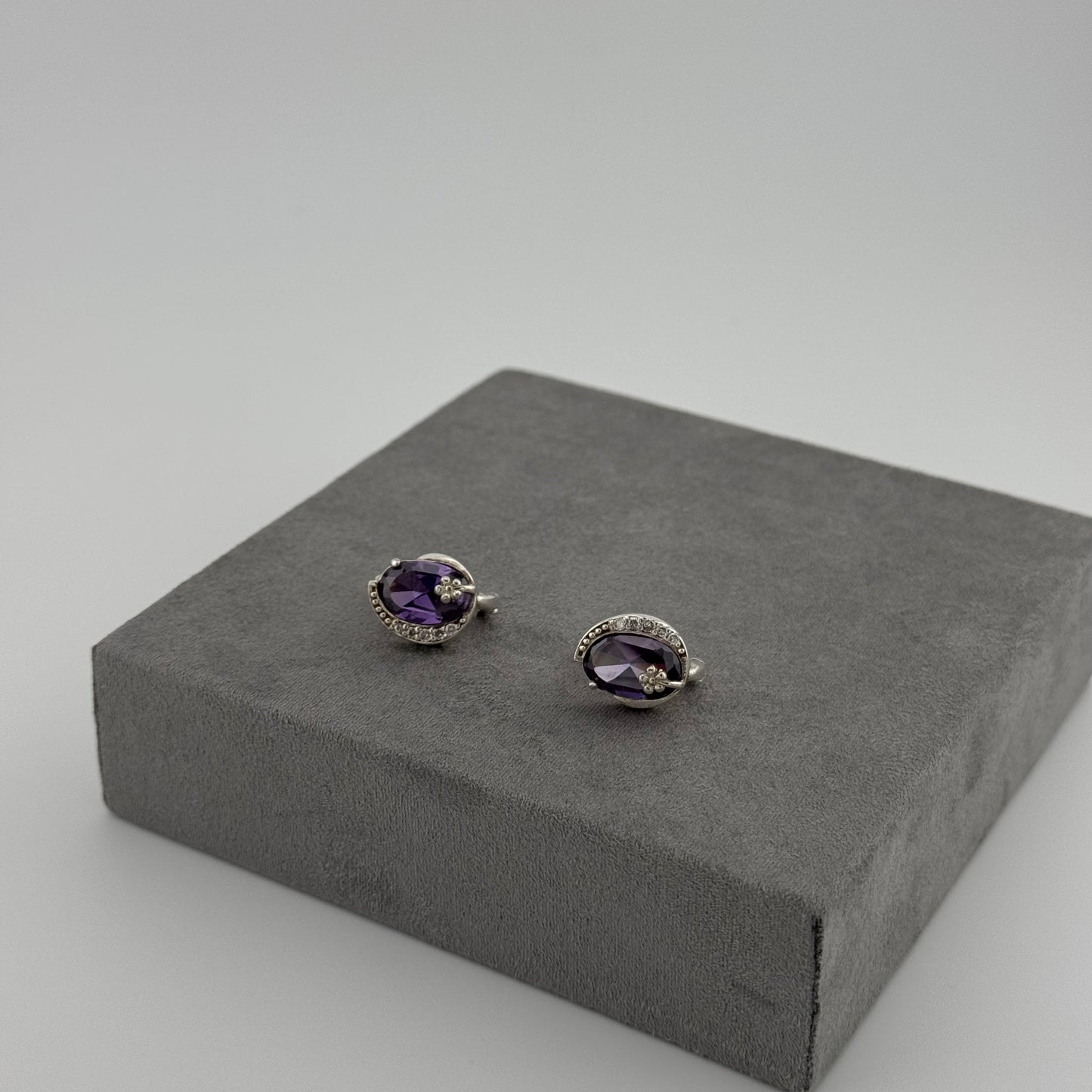 sterling silver amethyst earrings with an oval amethyst stone and floral design