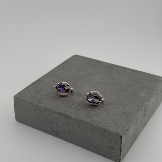 sterling silver amethyst earrings with an oval amethyst stone and floral design