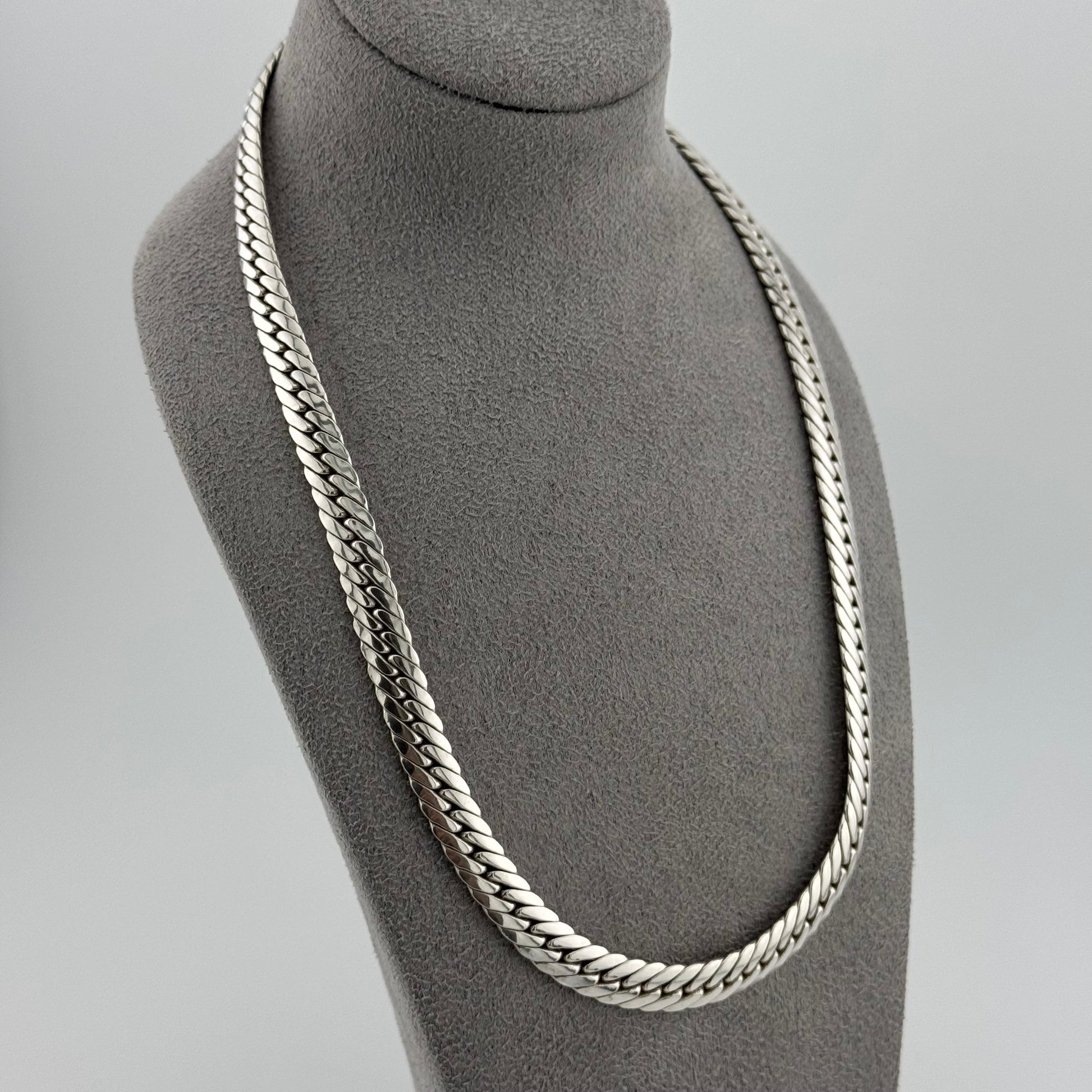 sterling silver heavy  herringbone chain 20 Inches in length on a grey bust