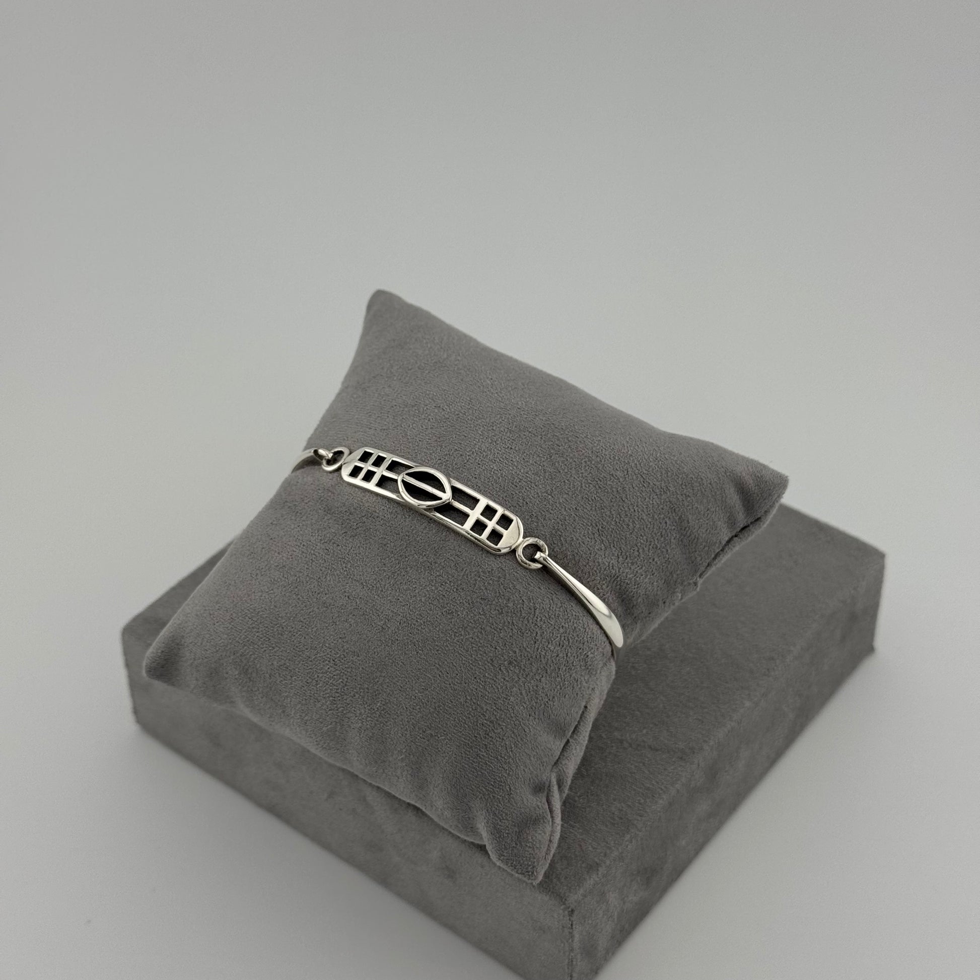silver kit heath bracelet displayed on grey cushion
