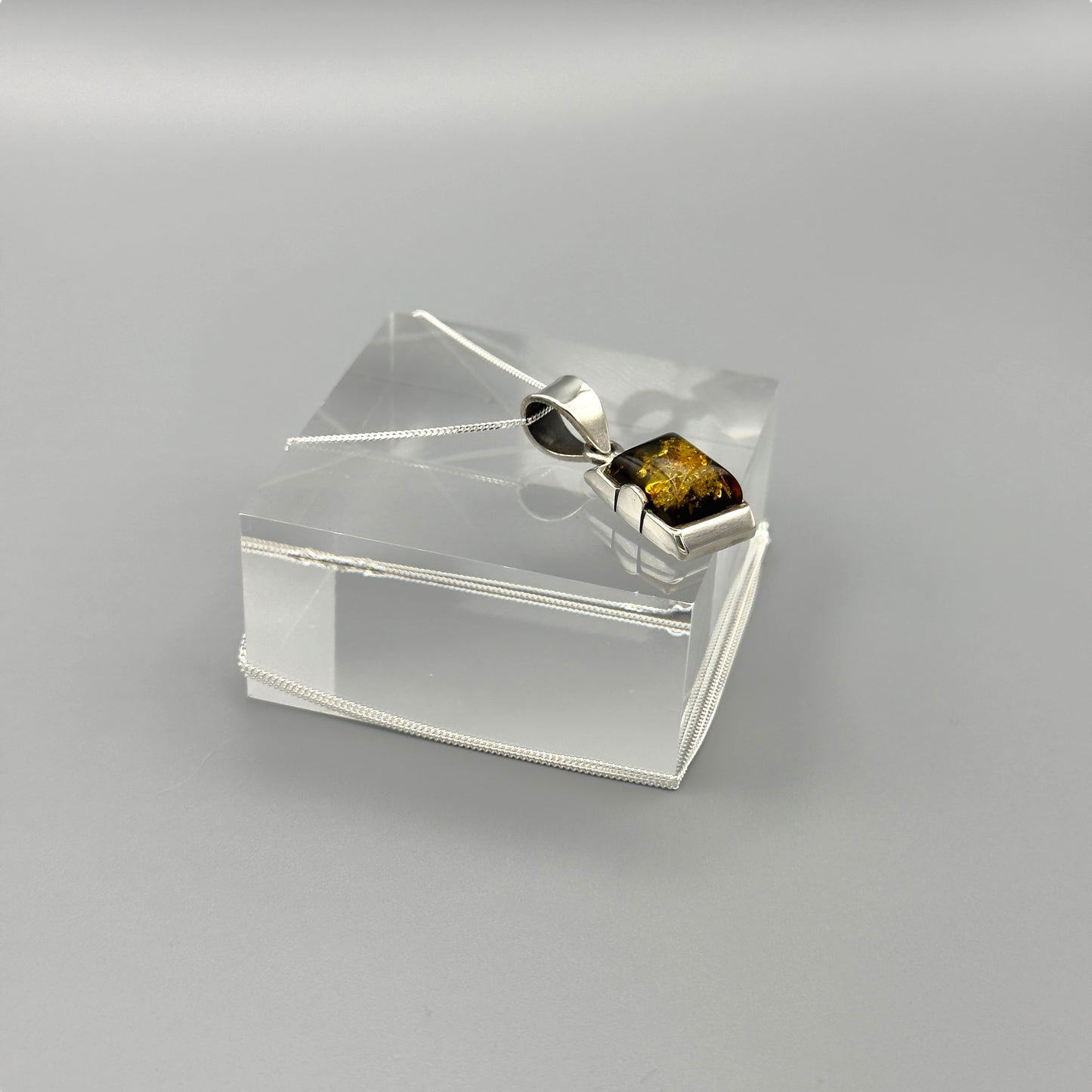 Close-up of amber stone’s golden flecks