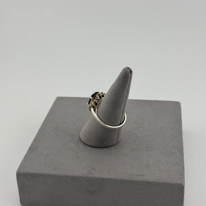 Blue Topaz Halo Ring - Sterling Silver