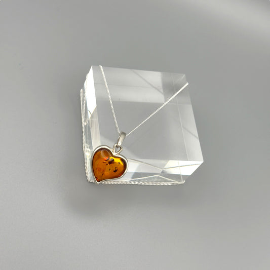 Sterling silver necklace with heart amber pendant