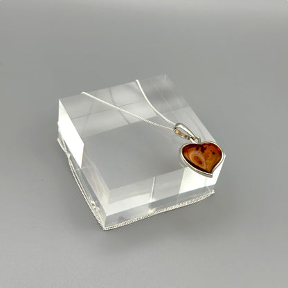 Close-up of heart-shaped Baltic amber necklace