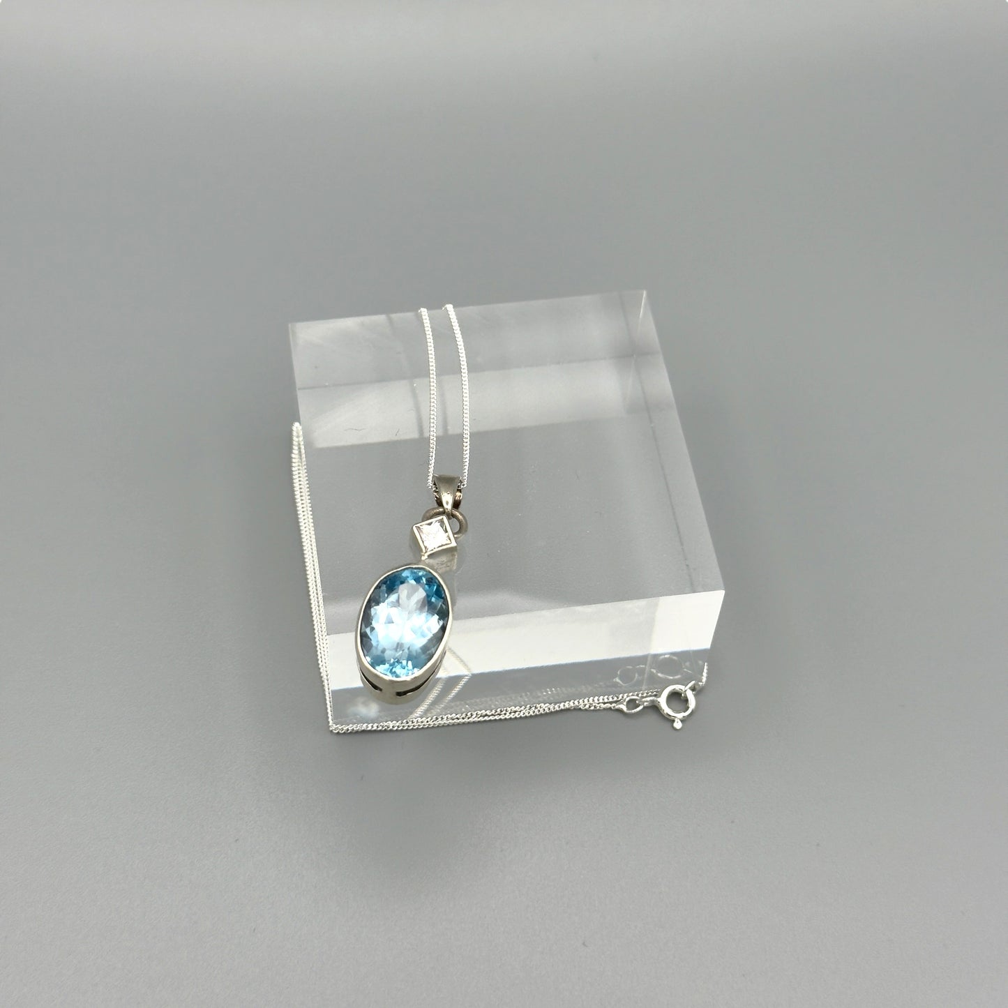 Sterling silver necklace with faceted aquamarine pendant