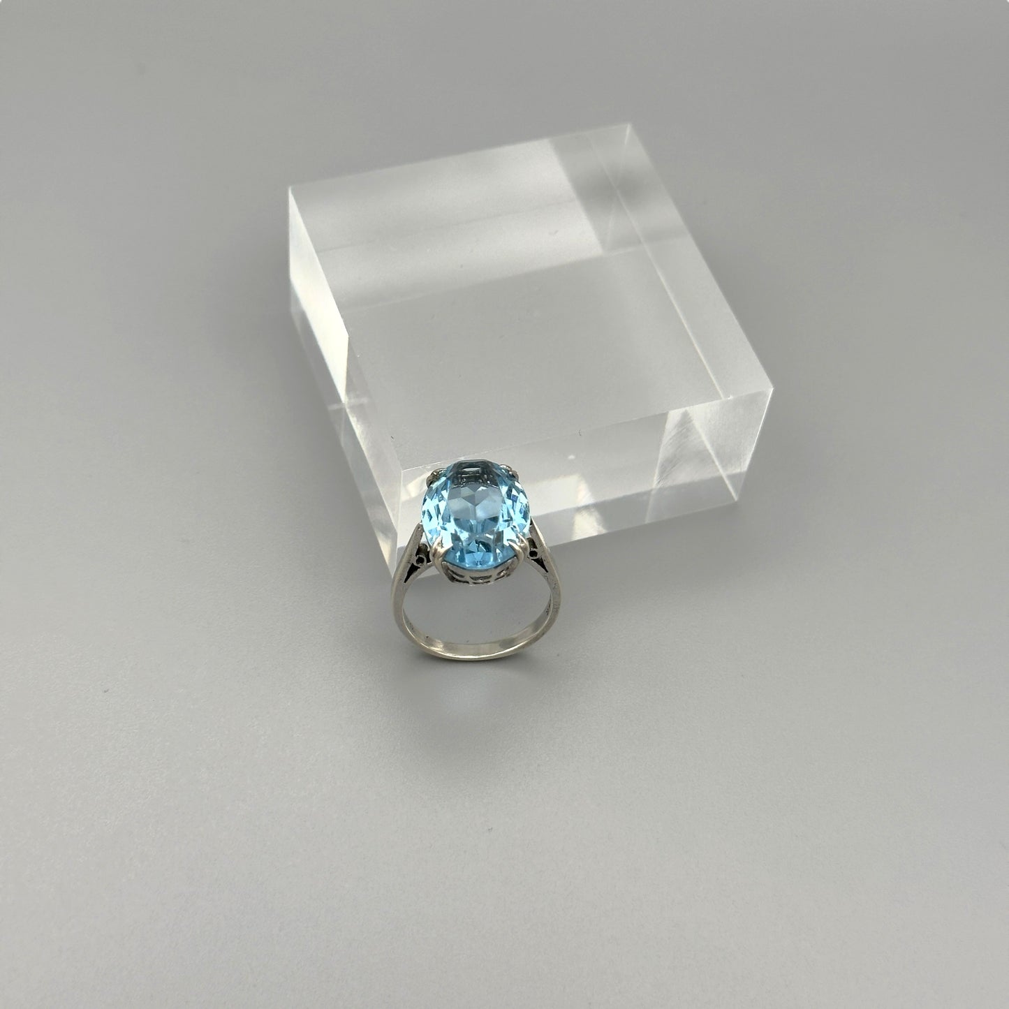 Aquamarine statement ring on clear cube display