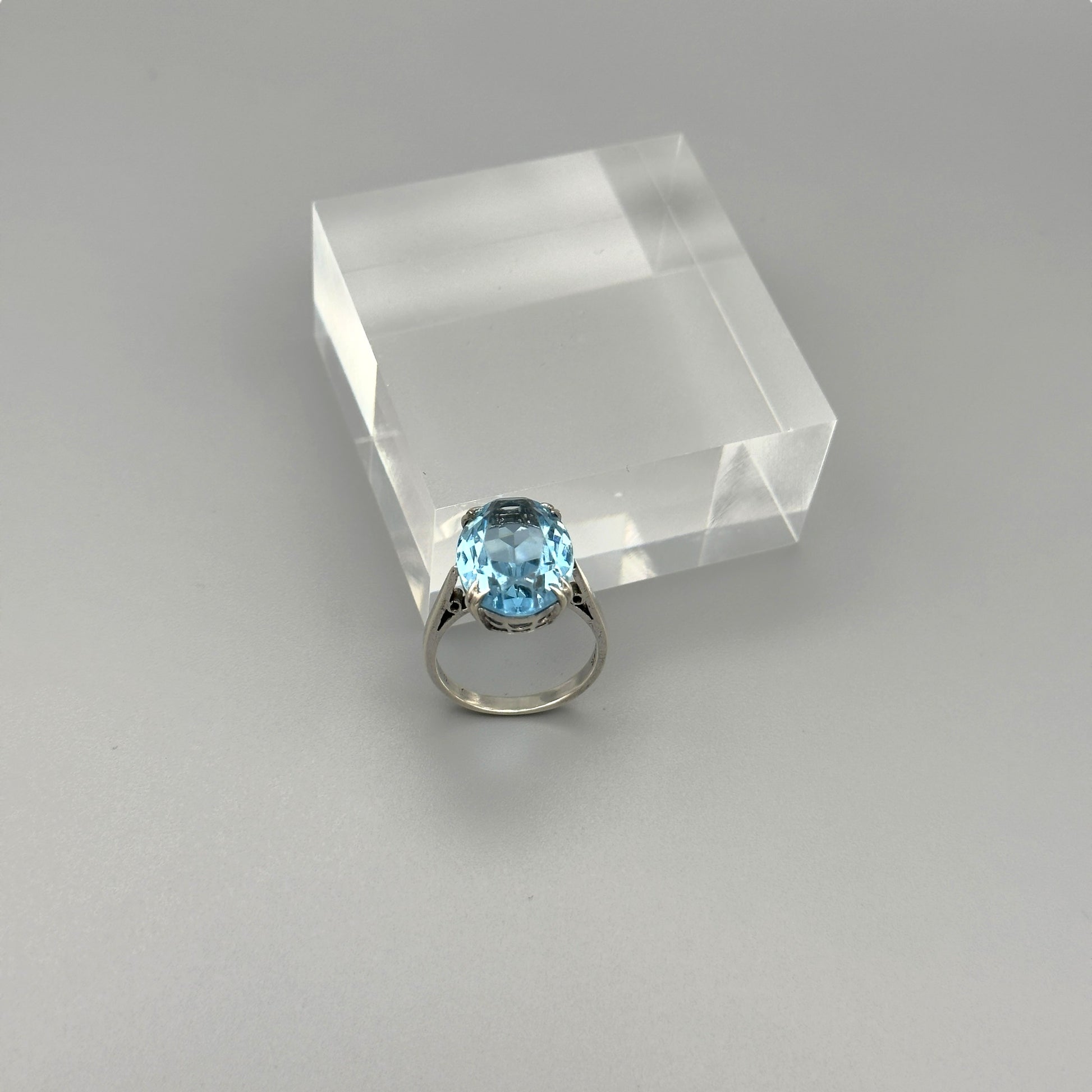 Aquamarine statement ring on clear cube display