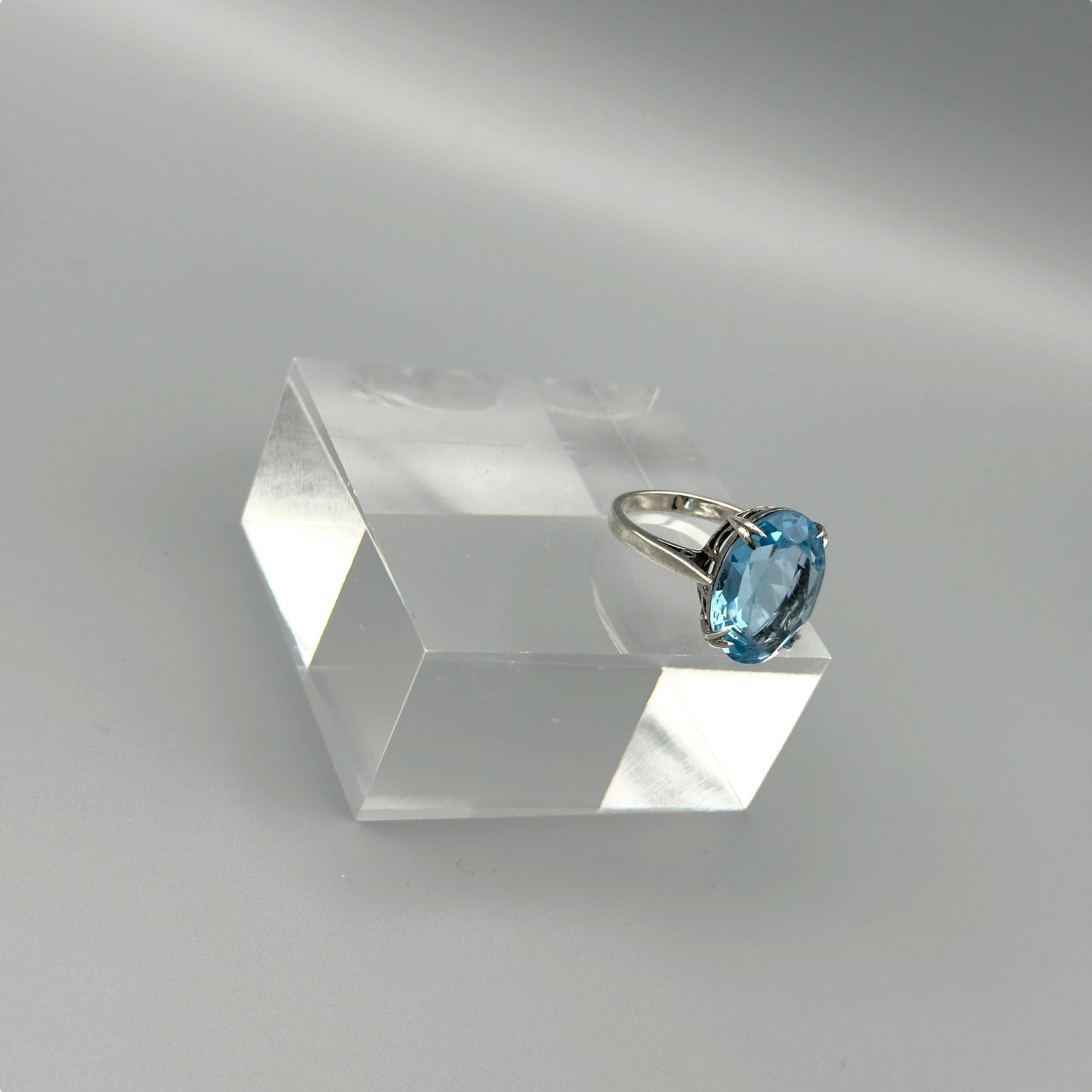 Oval aquamarine ring in silver four-prong setting