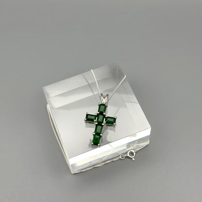 Overhead photo of sterling silver emerald cross necklace with clasp