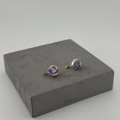 sterling silver amethyst earrings with an oval amethyst stone and floral design