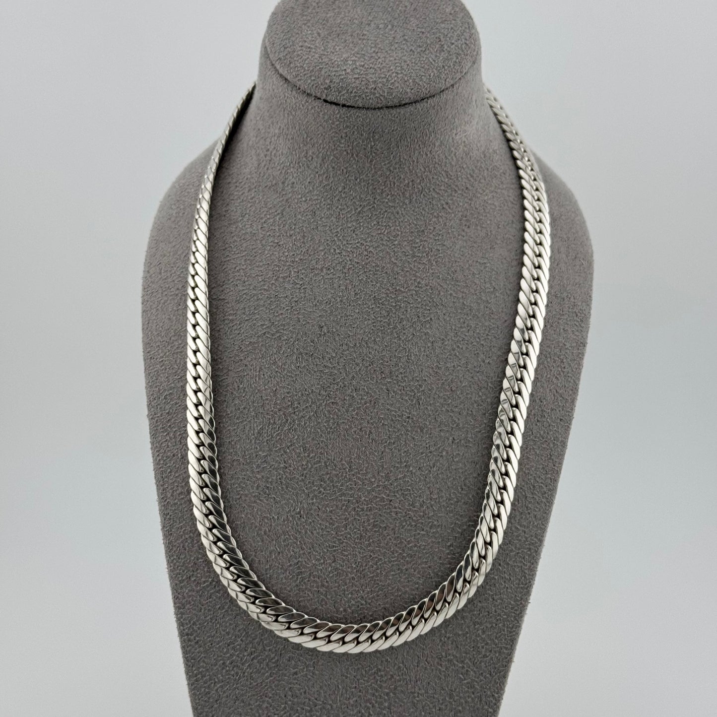sterling silver heavy  herringbone chain 20 Inches in length on a grey bust