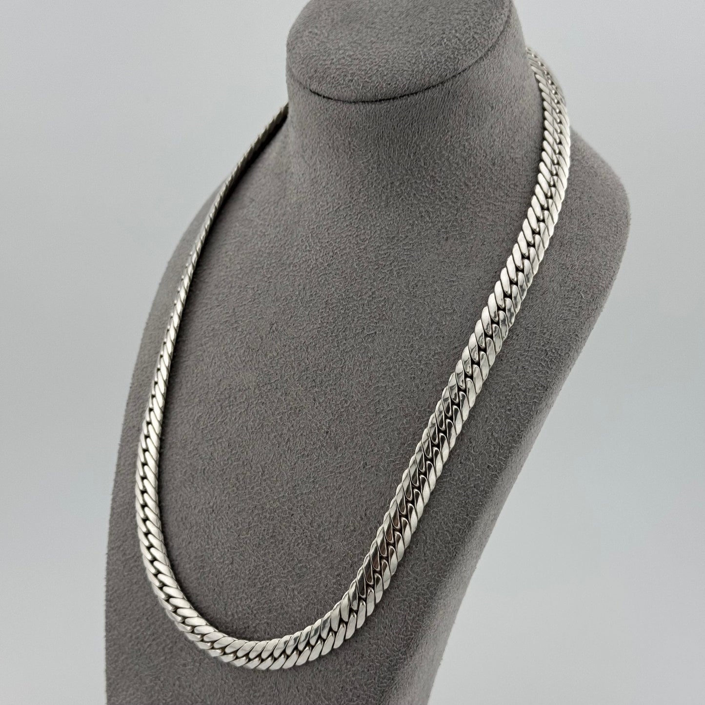 sterling silver heavy  herringbone chain 20 Inches in length on a grey bust