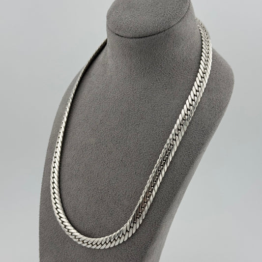 sterling silver heavy  herringbone chain 20 Inches in length on a grey bust