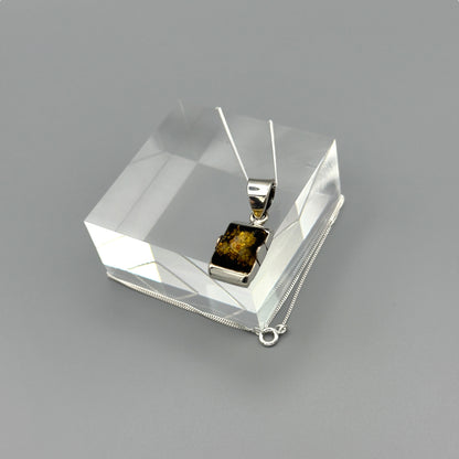 Sterling silver chain with amber pendant in box setting