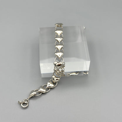 Sterling silver heart bracelet on acrylic display